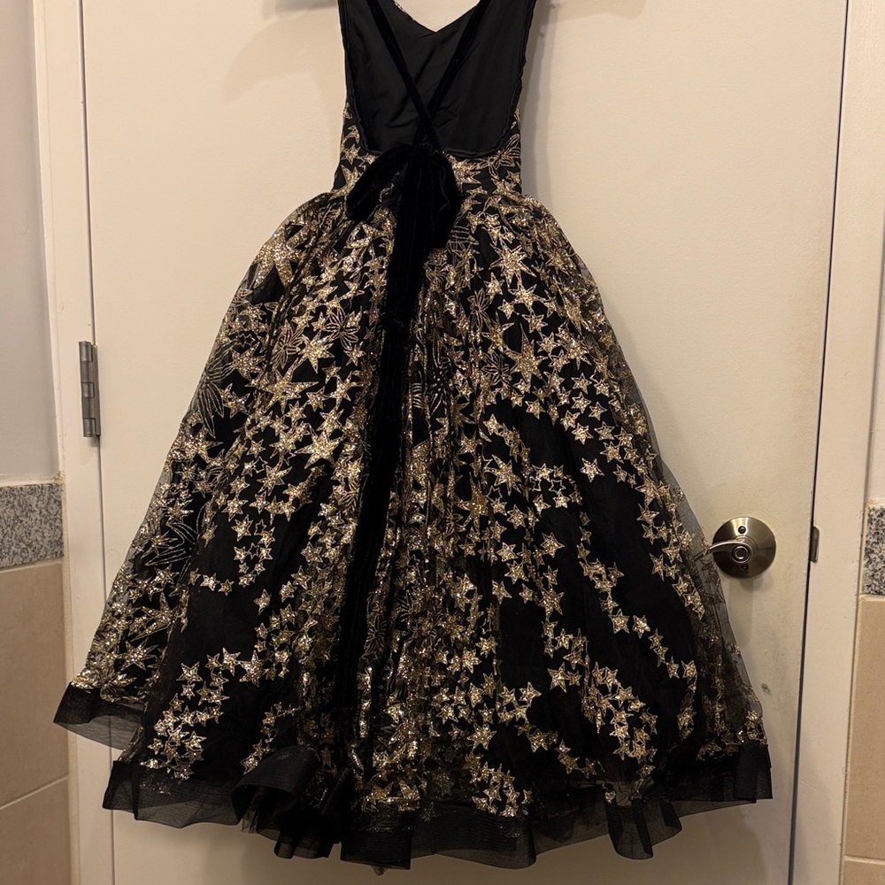 Little Girl's Black and Gold Star Patterned Formal Dress - Picture 3 of 14